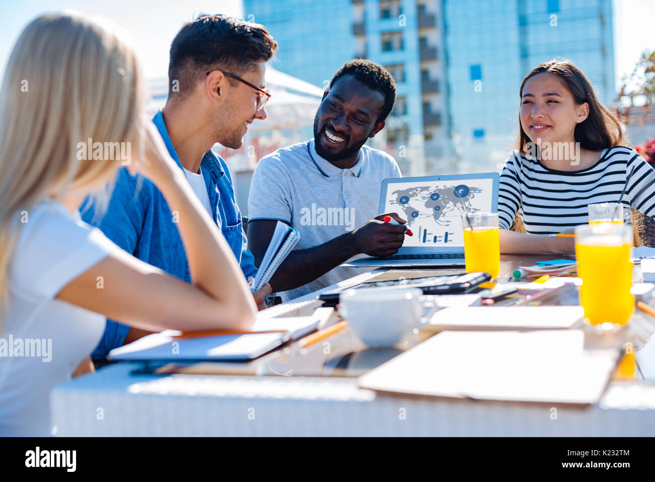 Happy minded international students discussing university project Stock Photo