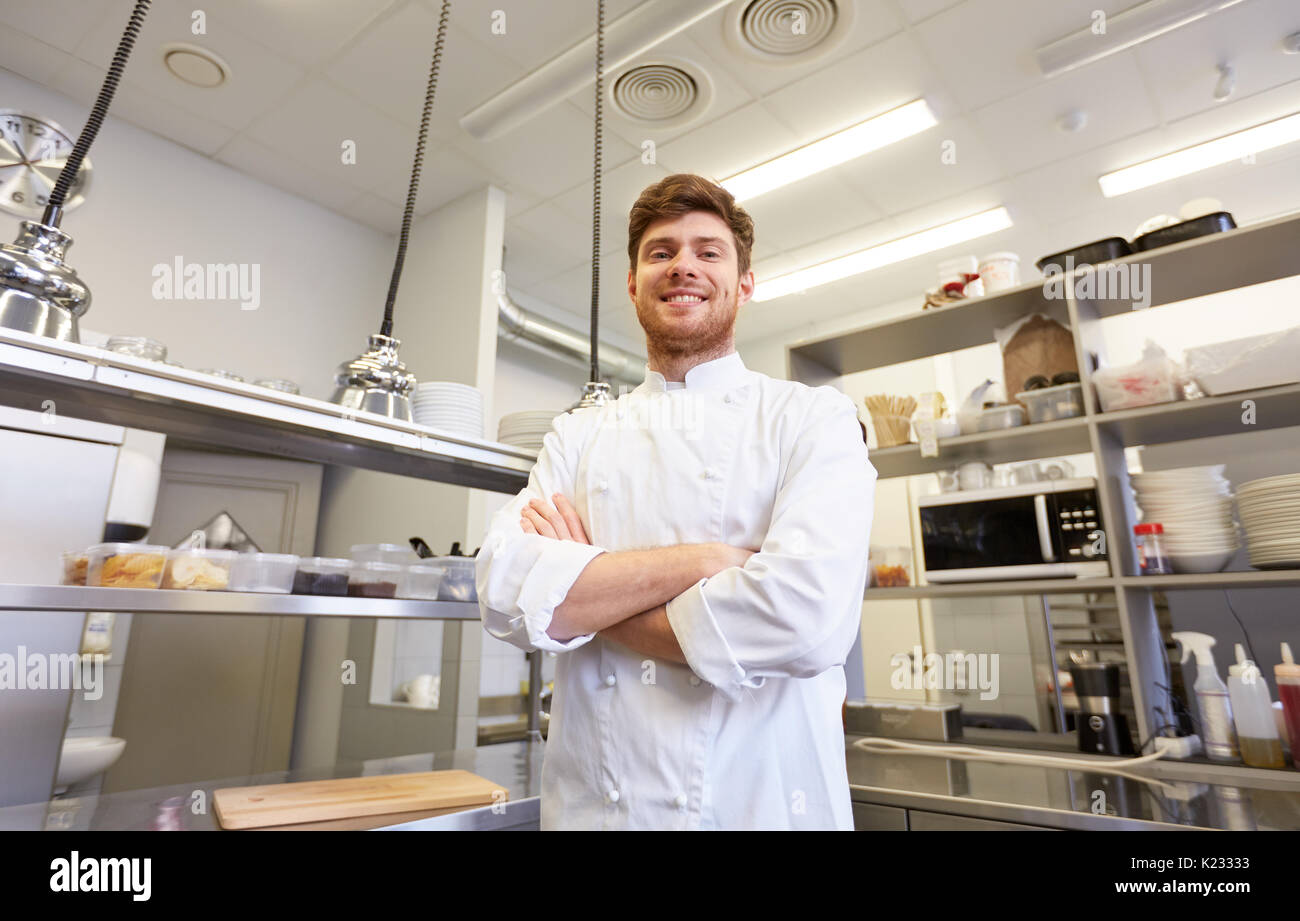 happy male chef cook at restaurant kitchen Stock Photo