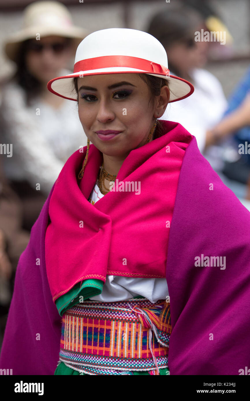 June 17, 2017 Pujili, Ecuador: indigenous female in colorful dress wearing a white hat at the Corpus Christi parade Stock Photo