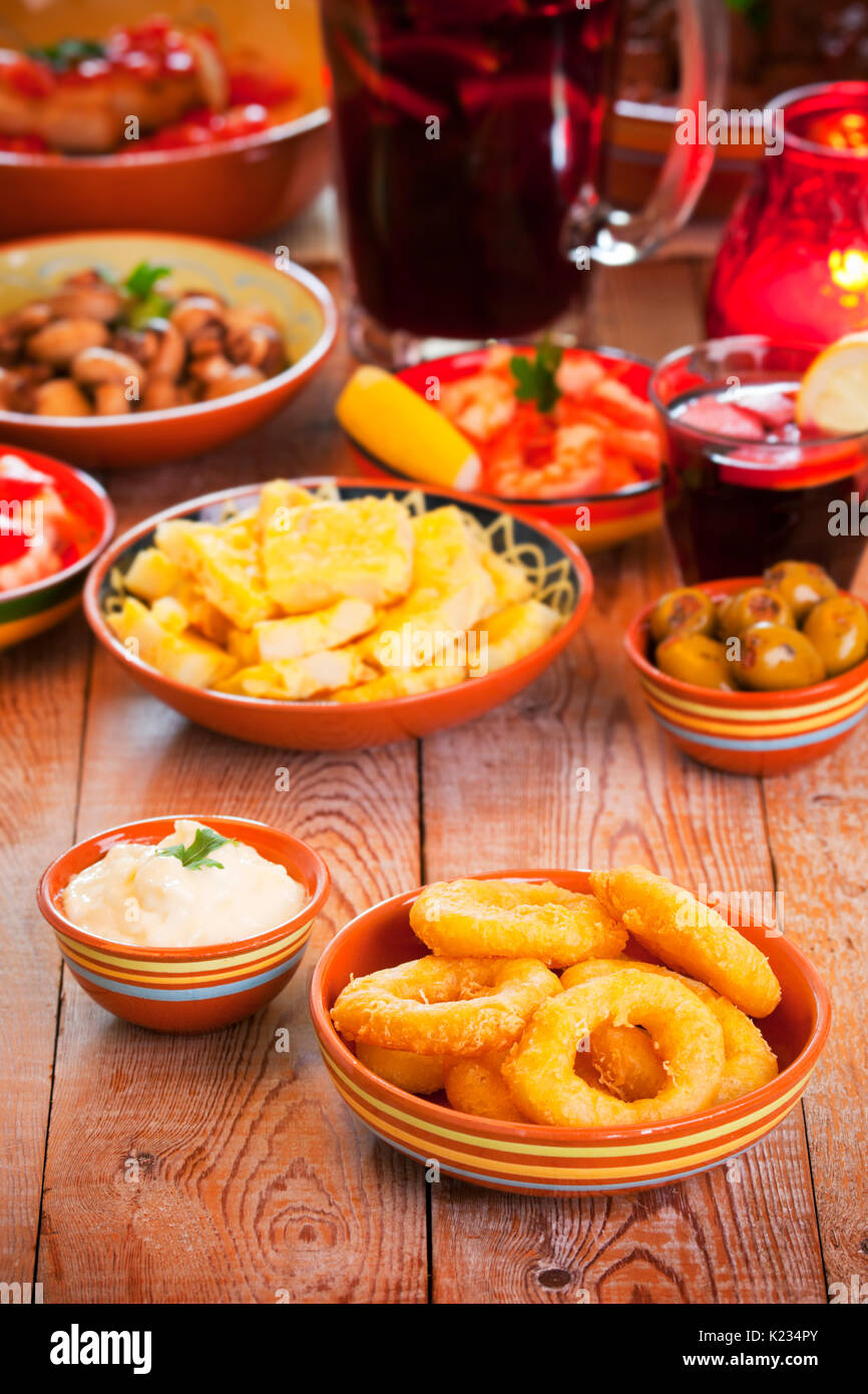 A table filled with all sorts of Spanish tapas and sangria. Stock Photo