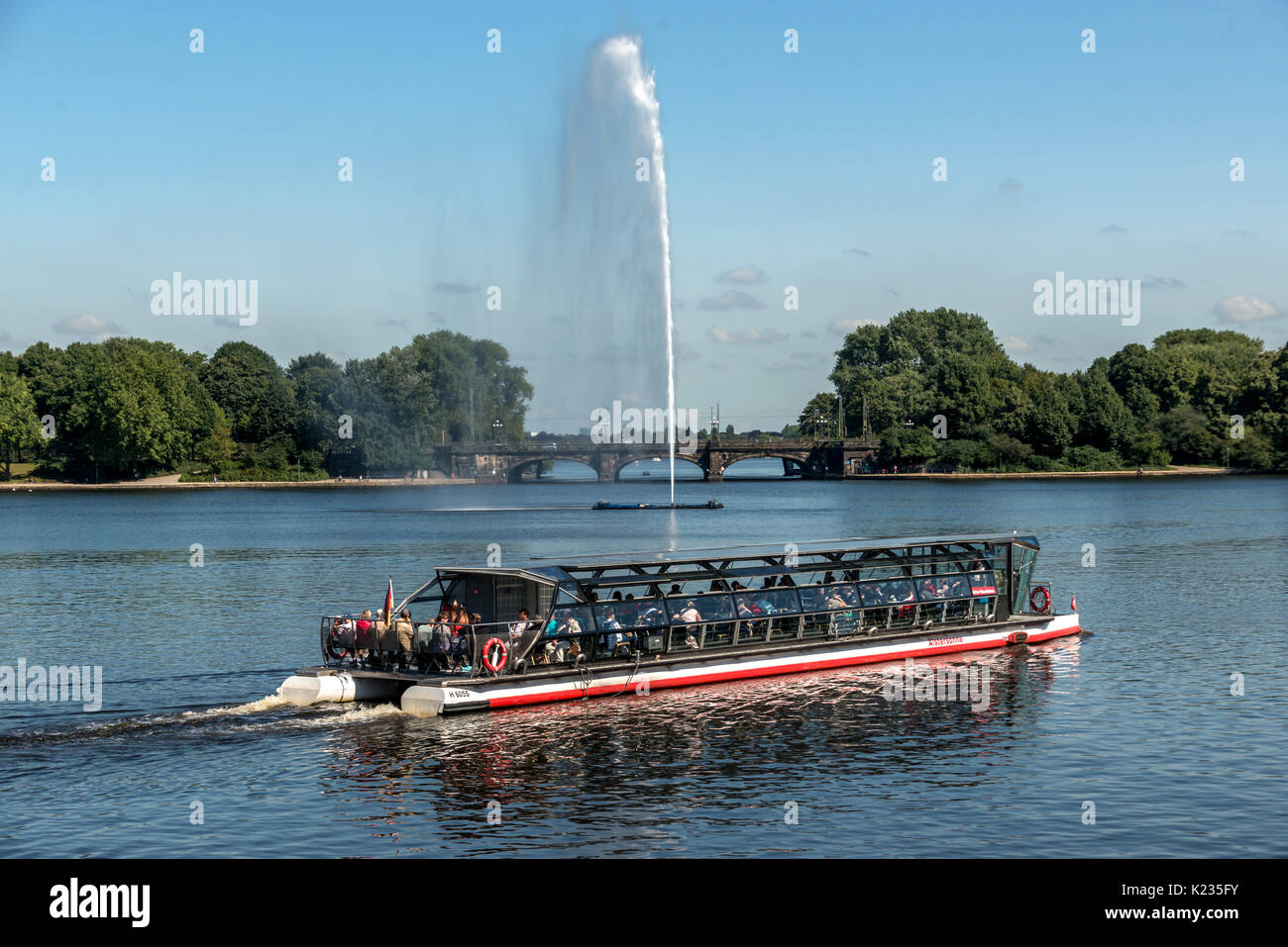 Tourist boats ply their trade on the Binnenalster in Hamburg, Germany