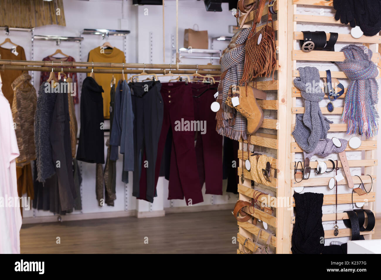 Warm clothing and accessories in modern garment store Stock Photo - Alamy