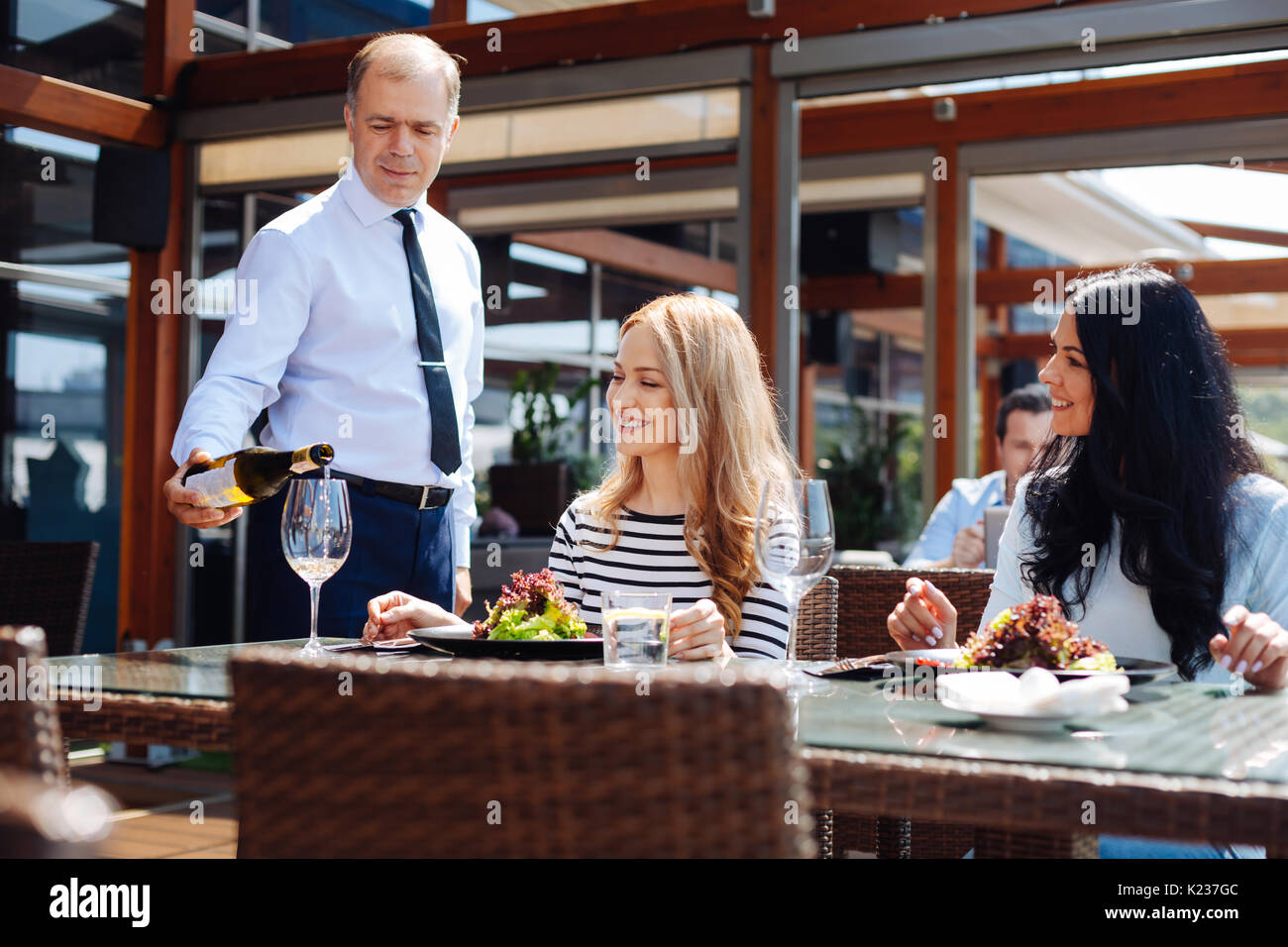 Professional skillful waiter pouring wine Stock Photo Alamy
