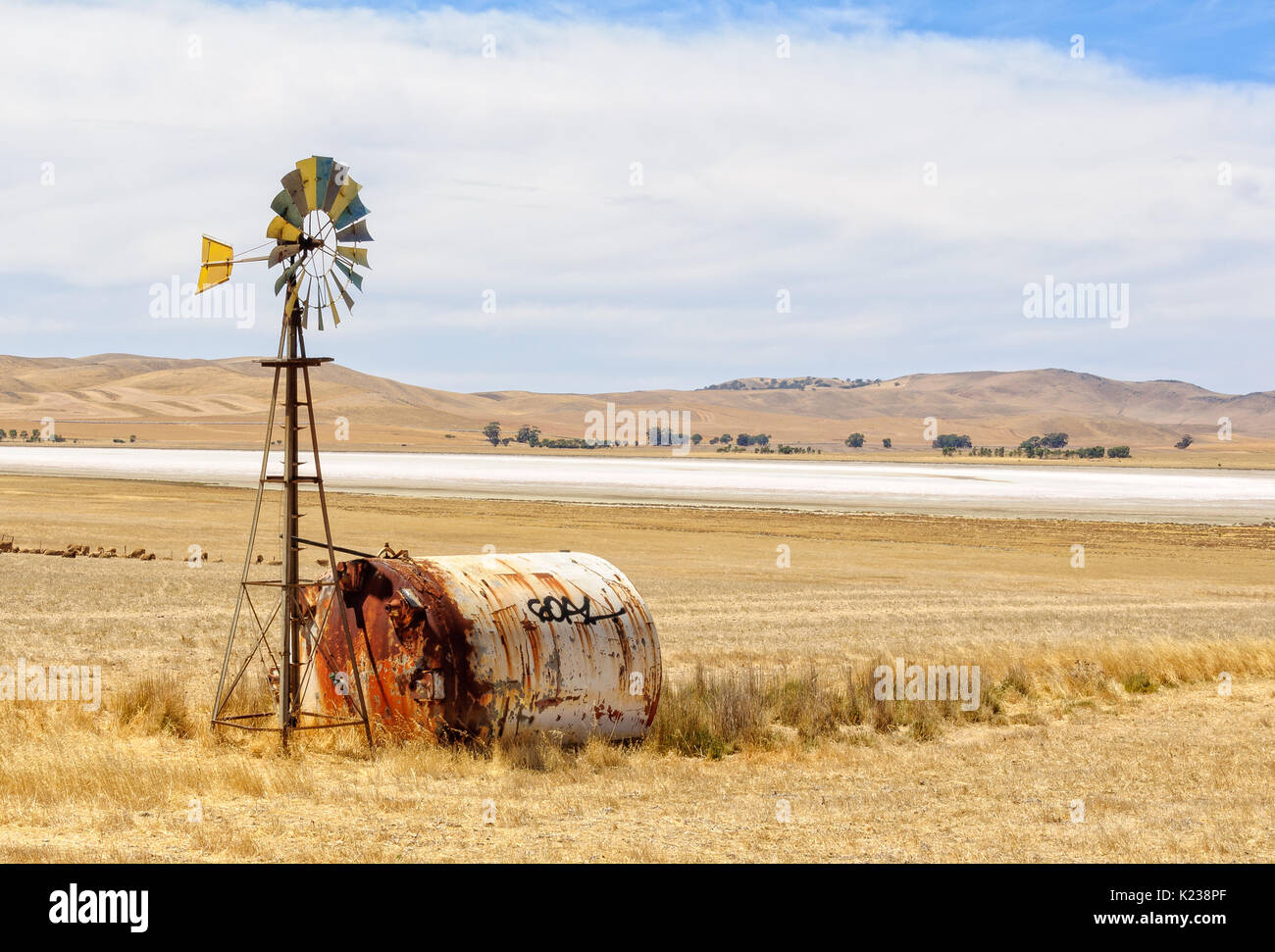 G'day in bush on a water tank next to wind wheel - SA, Australia Stock Photo