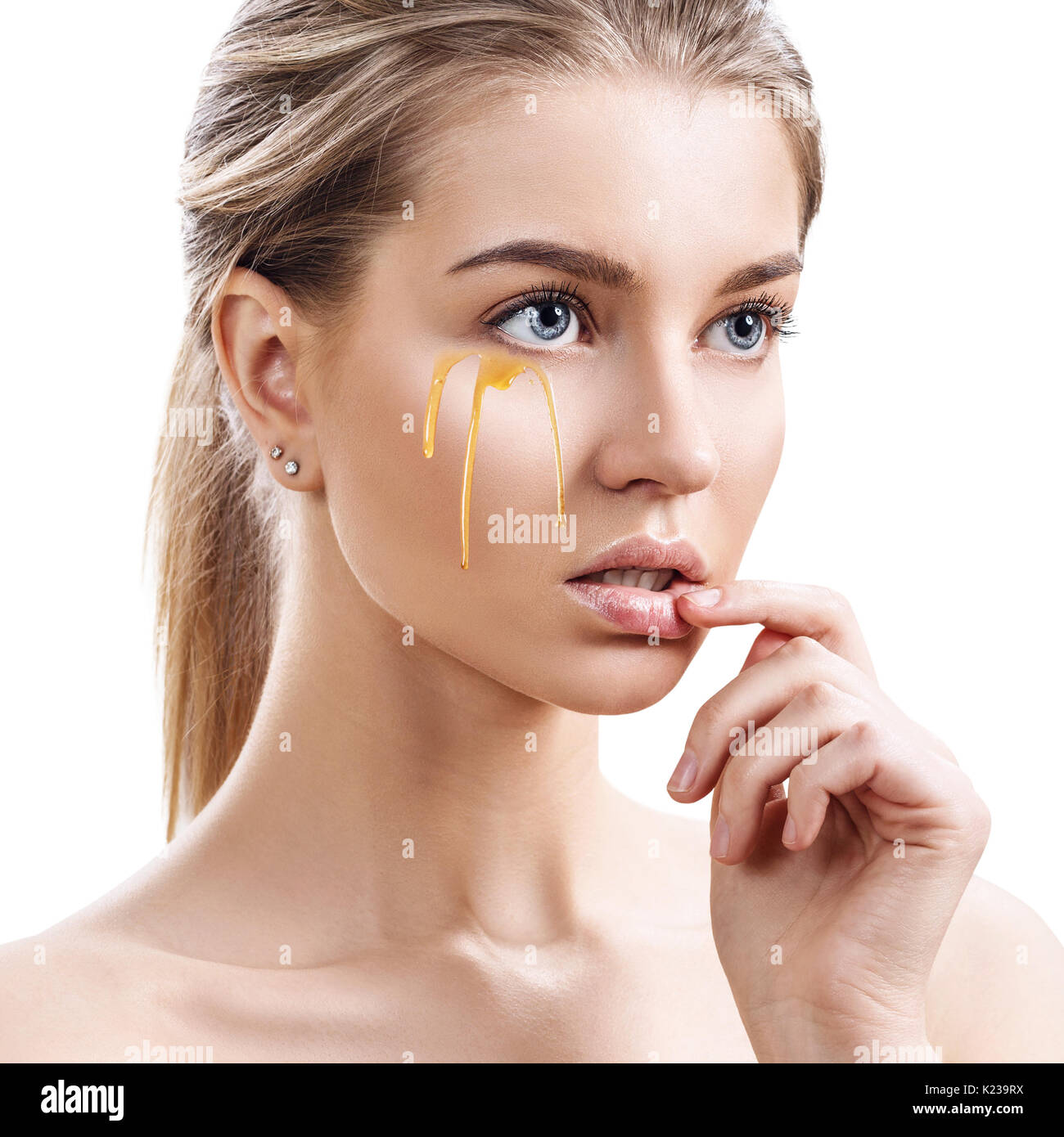 Beautiful woman with honey on face Stock Photo Alamy