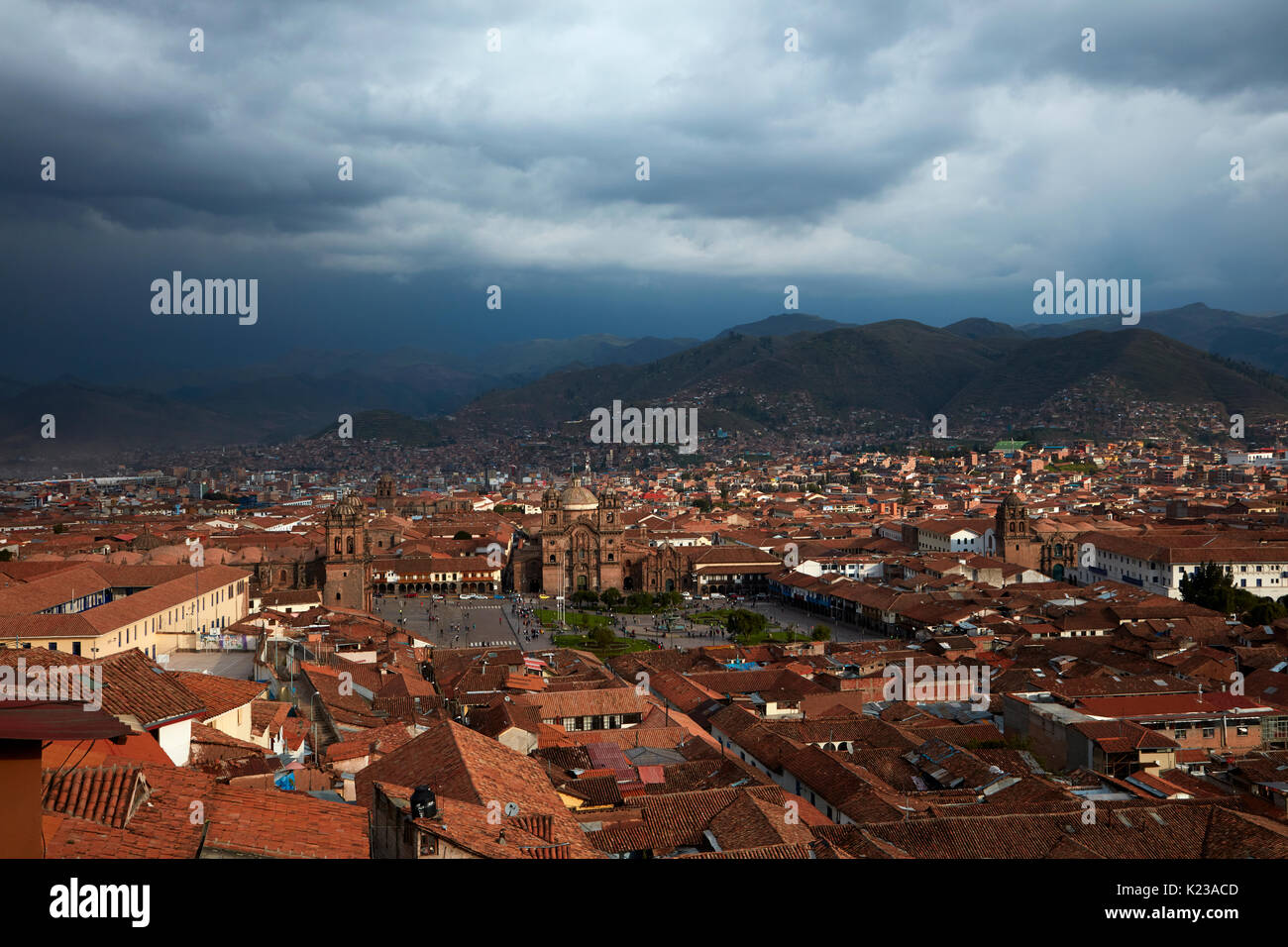 Iglesia de la Compania, people in Plaza de Armas, and terracotta roofs, Cusco, Peru, South America Stock Photo