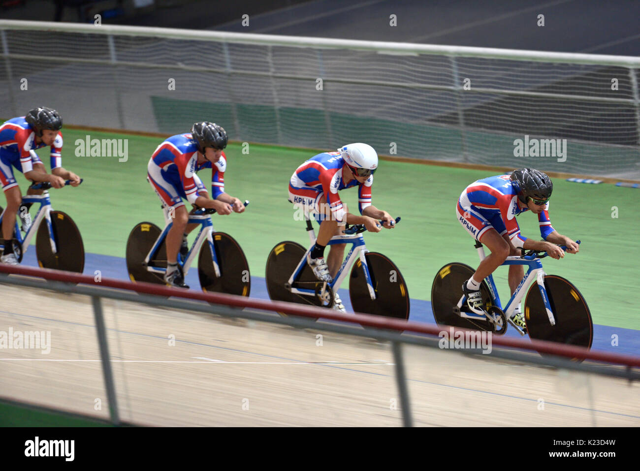 St. Petersburg, Russia - August 11, 2015: Unidentified riders compete in team race during Russian track cycling championship. Velodrome Lokosphinx hos Stock Photo