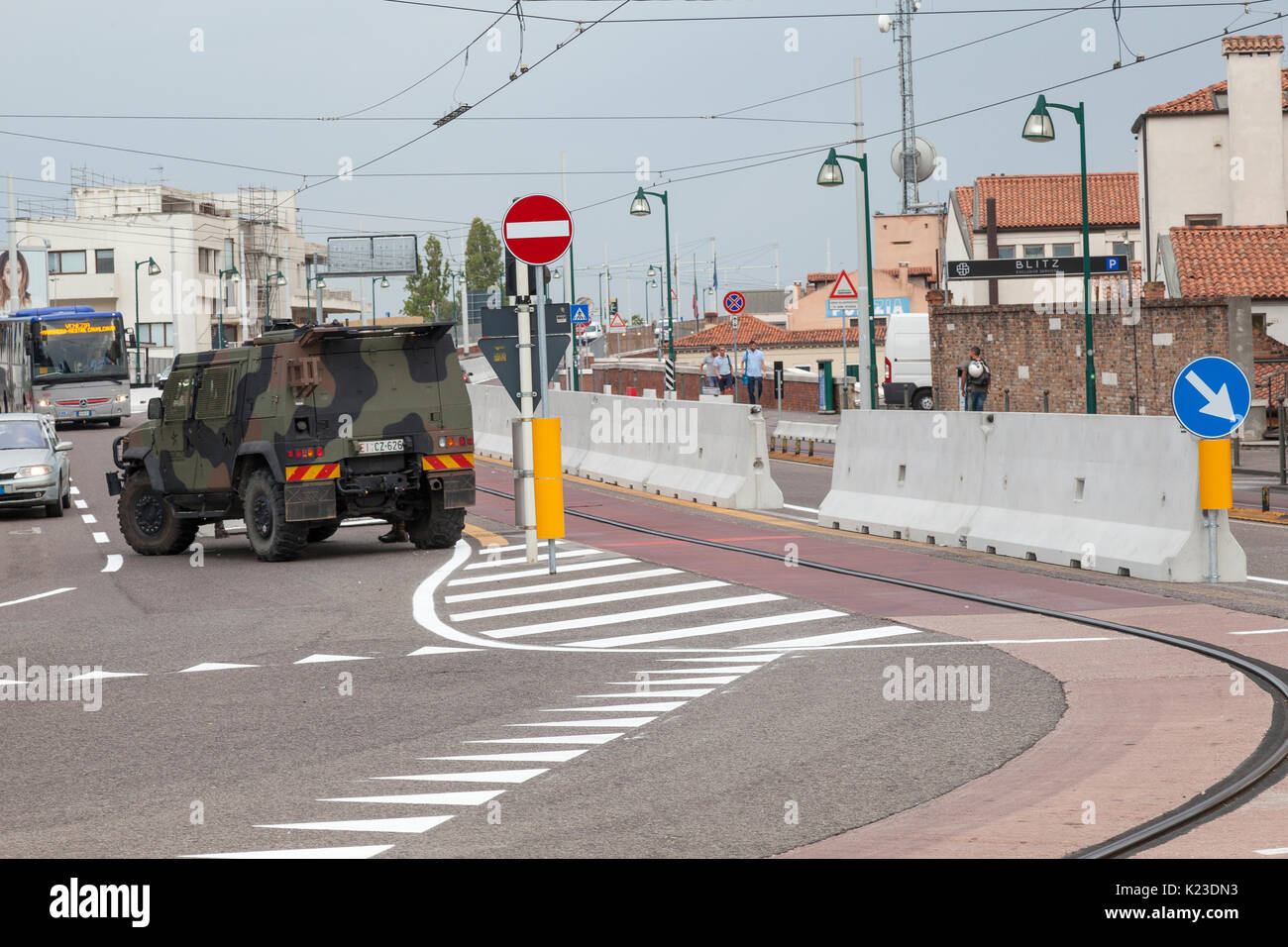 Venice, Veneto, Italy. 28th Aug, 2017. Anti-terror concrete barriers and police presence in Piazzale Roma ahead of the start of the Venice Film Festival. This is the first day after completion of the installation of the barriers to check the viabilty of traffic flow and pedestrians. An armoured car was in place on Ponte della Liberta blocking one lane. The barriers are designed to block any vehicular attack. Credit: Mary Clarke/Alamy Live News Stock Photo