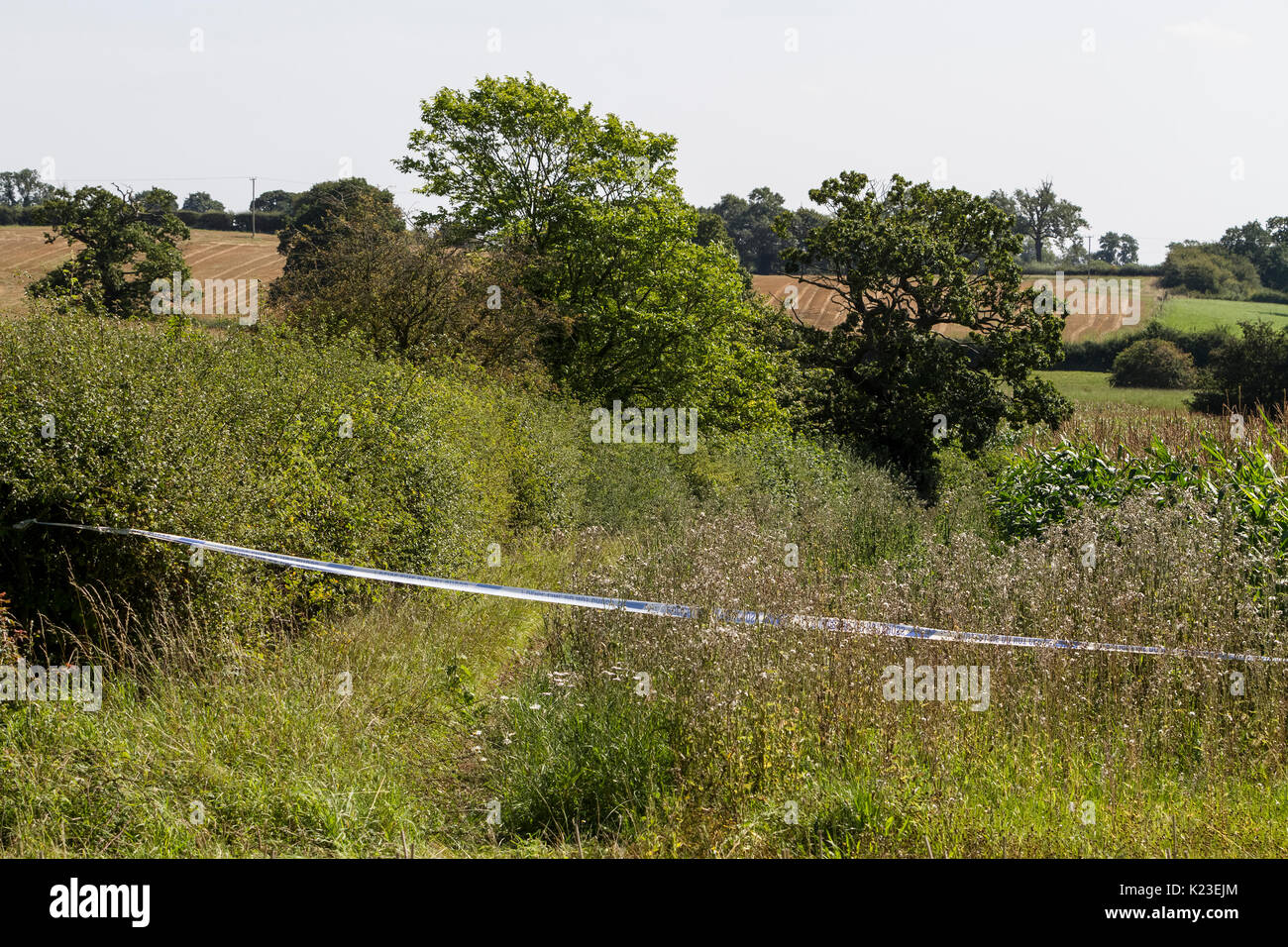 Blithfield Reservoir, Staffordshire, UK. 28th Aug, 2017. Police tape creates a cordon around the aftermath of a light aircraft plane crash in the small village of Abbots Bromley. An aircraft with one person on board crashed into a corn field and the causalty was air-lifted to Royal Stoke hospital for treatment. Blithfield Reservoir, Abbots Bromley, Staffordshire, UK. 28th August 2017. Credit: Richard Holmes/Alamy Live News Stock Photo
