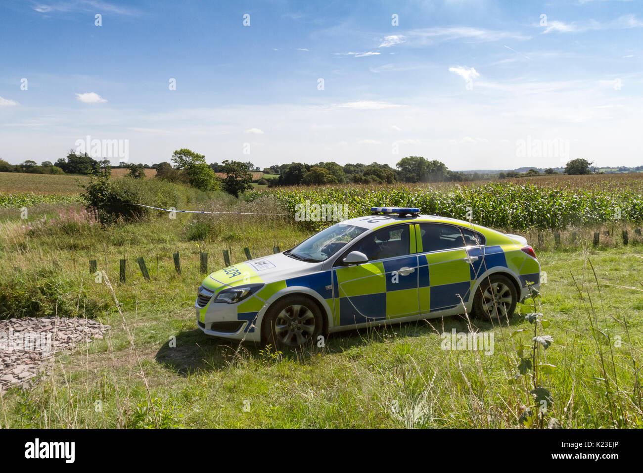 Blithfield Reservoir, Staffordshire, UK. 28th Aug, 2017. Police cars guard the aftermath of a light aircraft plane crash in the small village of Abbots Bromley. An aircraft with one person on board crashed into a corn field and the causalty was air-lifted to Royal Stoke hospital for treatment. Blithfield Reservoir, Abbots Bromley, Staffordshire, UK. 28th August 2017. Credit: Richard Holmes/Alamy Live News Stock Photo