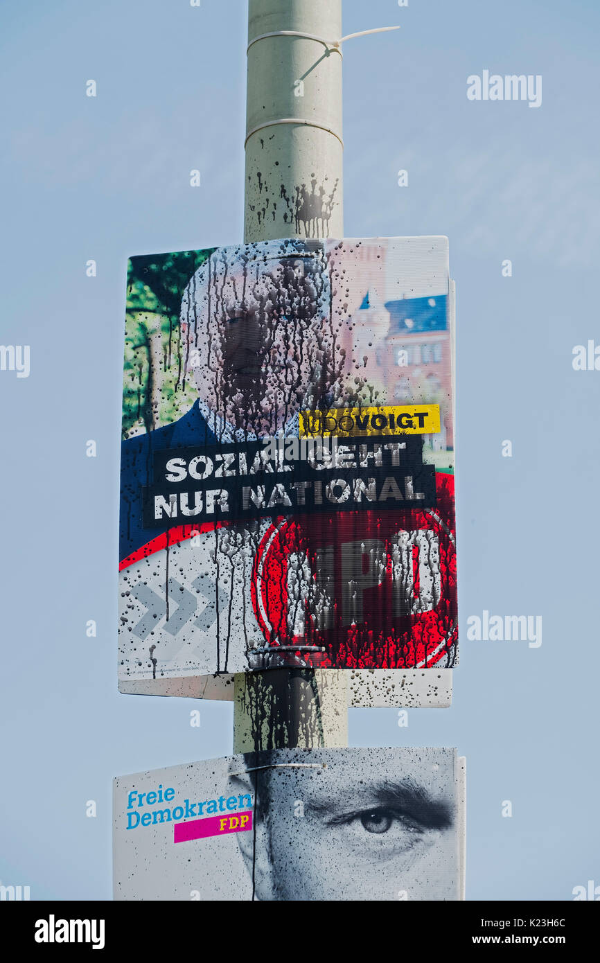 Berlin, Germany. 28th August 2017. Defaced party political poster for far-right neo-Nazi NPD party, National Democratic Party of Germany featuring former leader Udo Voigt in Eastern district of Berlin for Federal elections on 24th September 2017. Credit: Iain Masterton/Alamy Live News Stock Photo