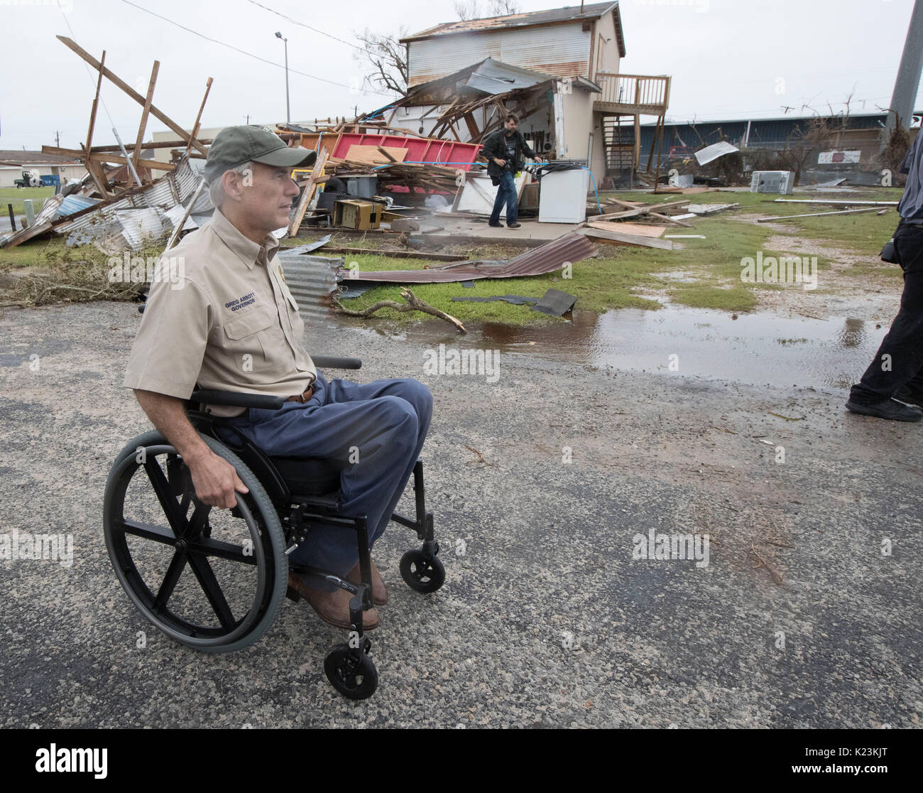 Rockport, Texas USA Aug. 28, 2017: Texas Gov. Greg Abbott (in wheelchair) tours Hurricane Harvey storm damage in Rockport about 30 miles north of Corpus Christi, TX three days after the historic Category 4 storm made landfall along the Texas Coast Credit: Bob Daemmrich/Alamy Live News Stock Photo