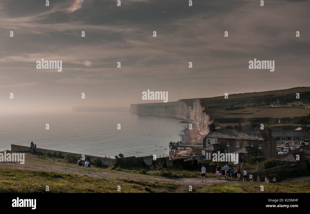 Birling Gap, East Sussex, UK. 28th Aug, 2017. Normality returns after yesterdays noxious cloud that remains unexplained as the harmless, normal, sea mist rolls in partly obscuring the Seven Sisters chalk cliffs. Yesterday the beach was evacuated and some 150 persons were treated in hospital. Stock Photo