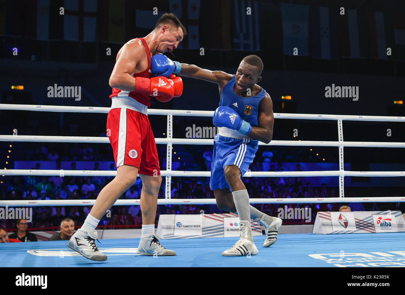 dpatop - German boxer Abass Baraou (R) is fighting Tuvshinbat Byamba from  Mongolia in the Men's Welter (69kg) quarterfinal in Hamburg in the  Sporthalle Hamburg, Germany, 29 August 2017. Baraou won by