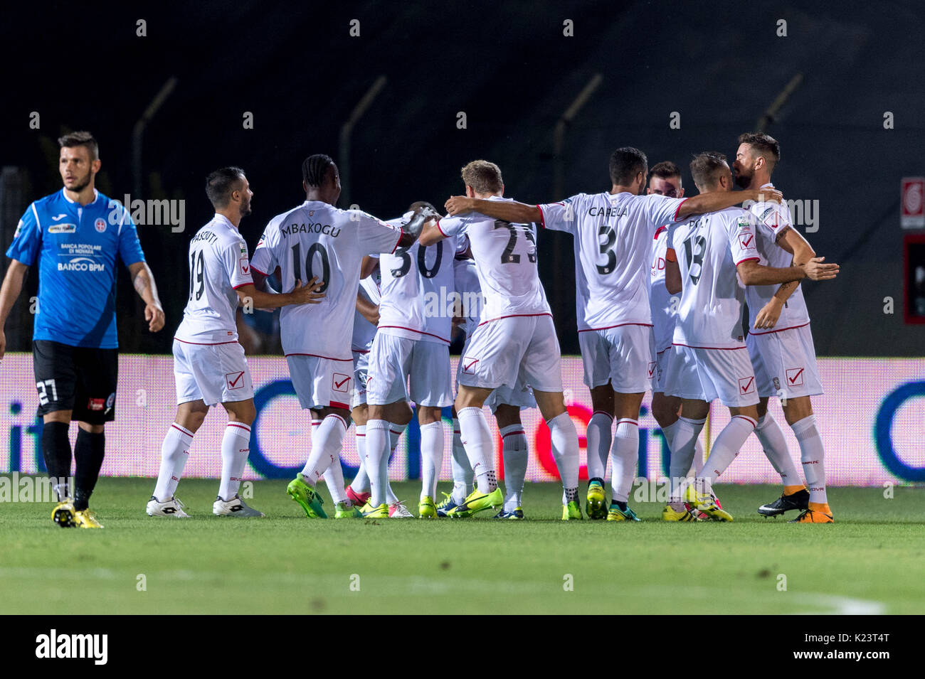 Carpi, Italy. 26th Aug, 2017. Carpi team group Football/Soccer : Giancarlo Malcore of Carpi celebrates with his teammates after scoring a goal as Marco Calderoni of Novara looks dejected during the Italian 'Serie B' match between Carpi FC 1-0 Novara Calcio at Stadio Sandro Cabassi in Carpi, Italy . Credit: Maurizio Borsari/AFLO/Alamy Live News Stock Photo