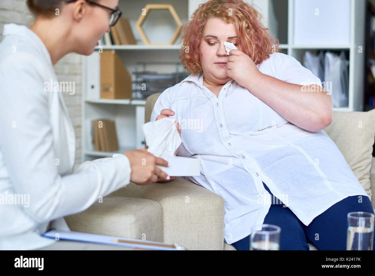 Obese Young Woman  Discussing Mental Problems with Psychiatrist Stock Photo