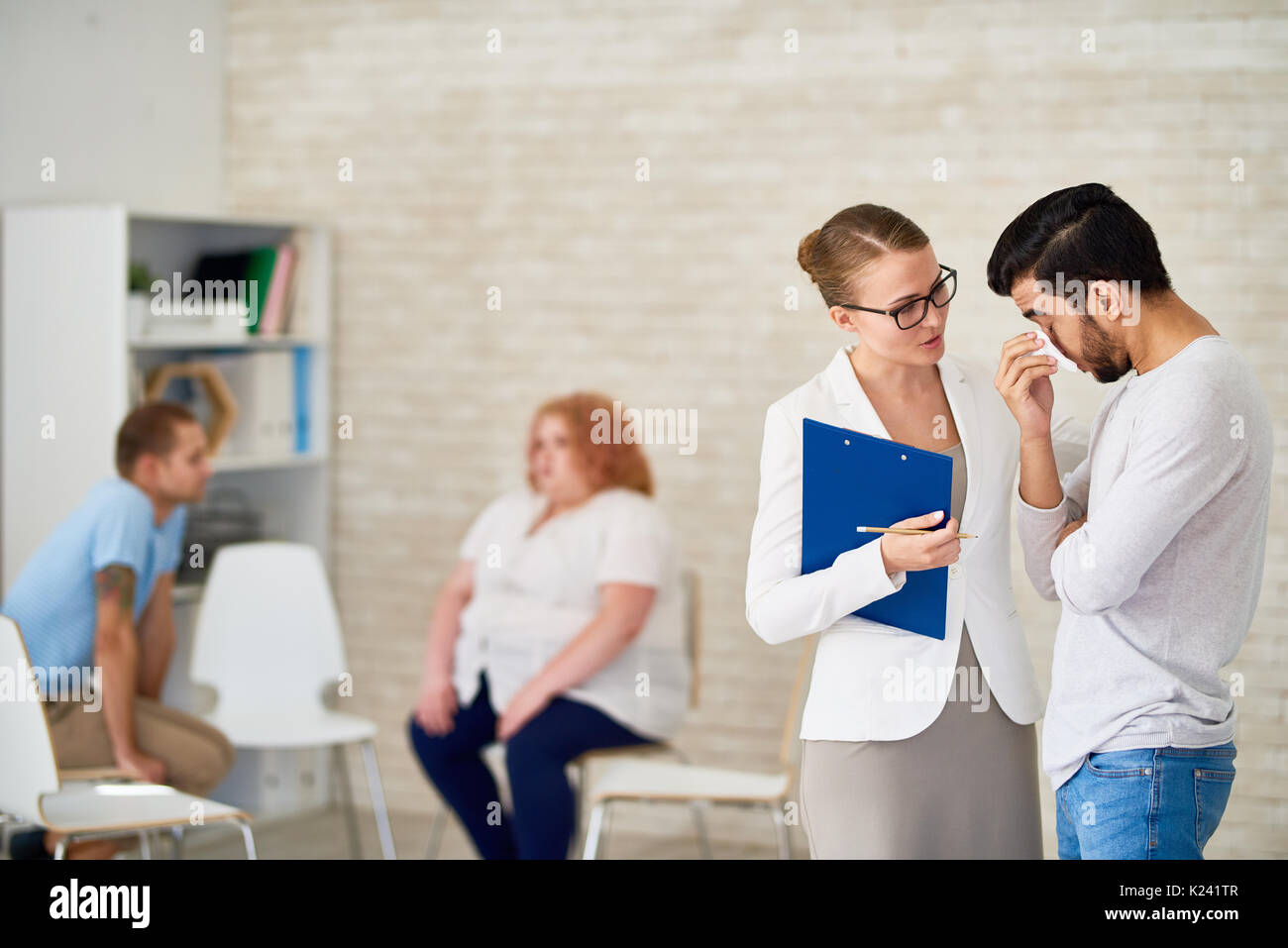 Beautiful Psychiatrist Consulting Crying Young Man Stock Photo Alamy