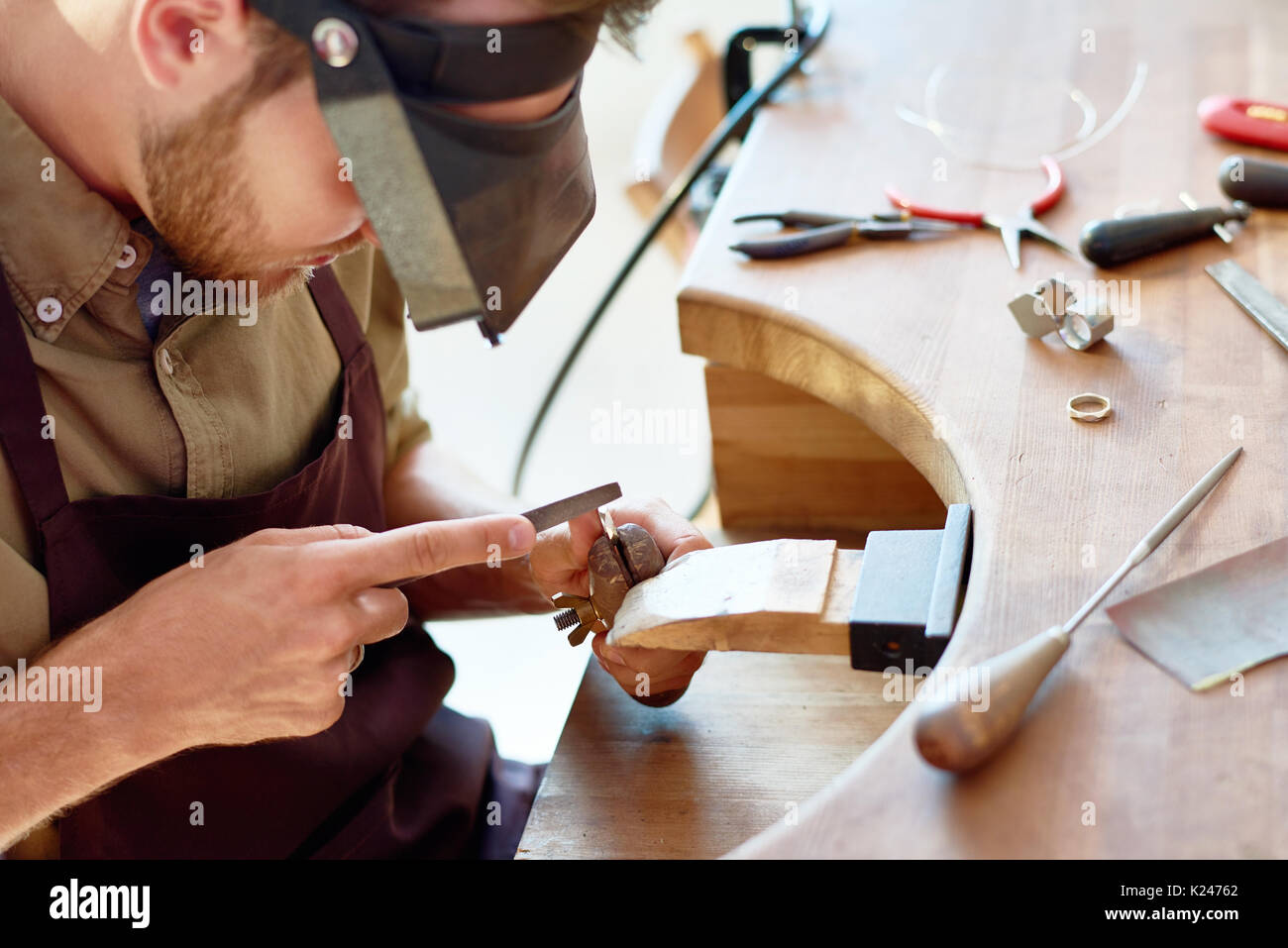 Young Jeweler Making Ring Stock Photo