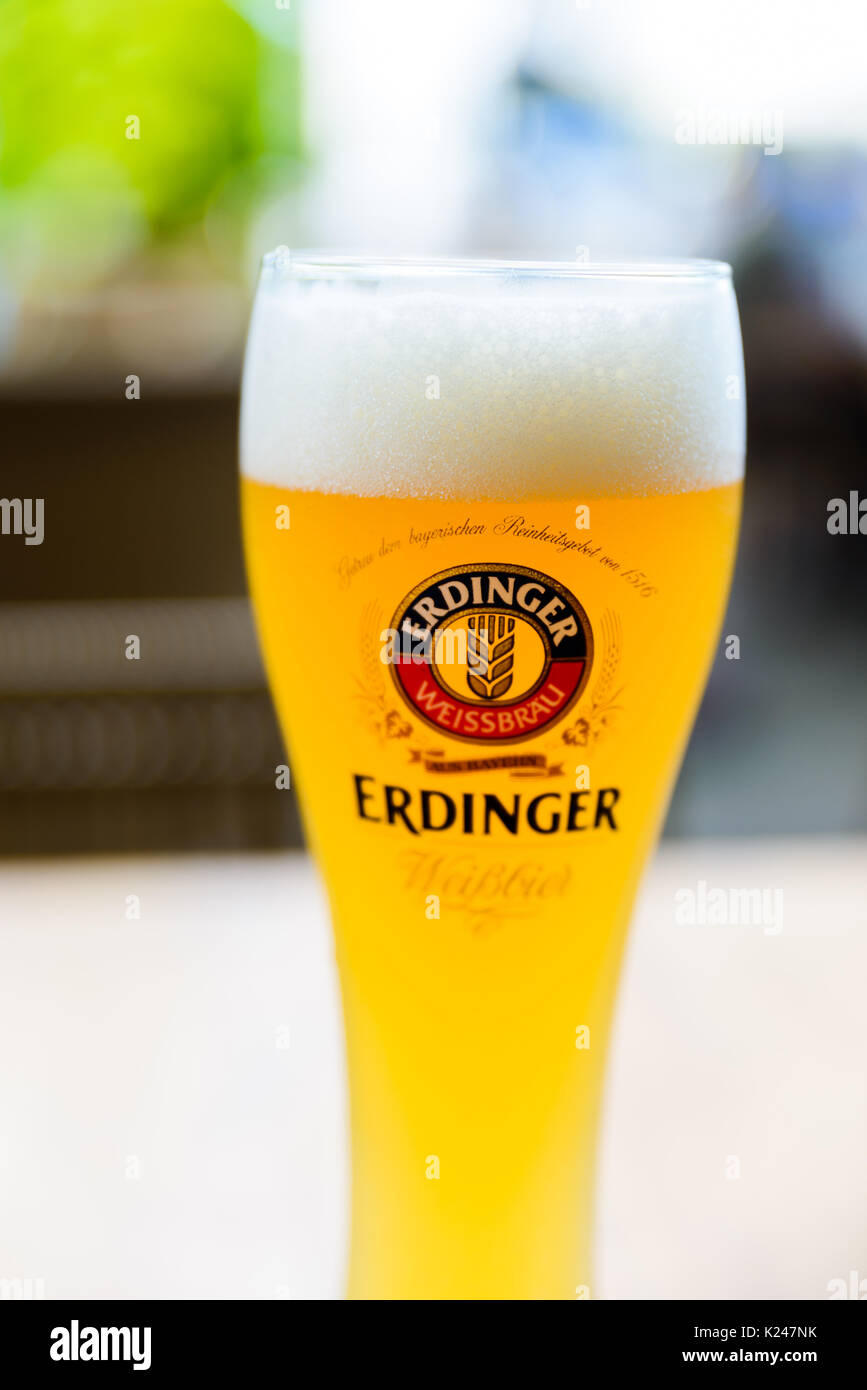 SINGAPORE CITY, SINGAPORE - CIRCA JANUARY 2016: A glass of Erdinger beer at a restaurant terrace. Stock Photo