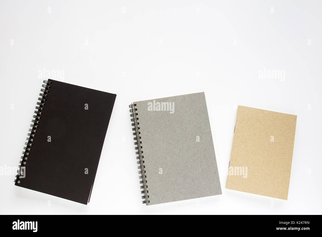 Notebooks on white background Stock Photo - Alamy