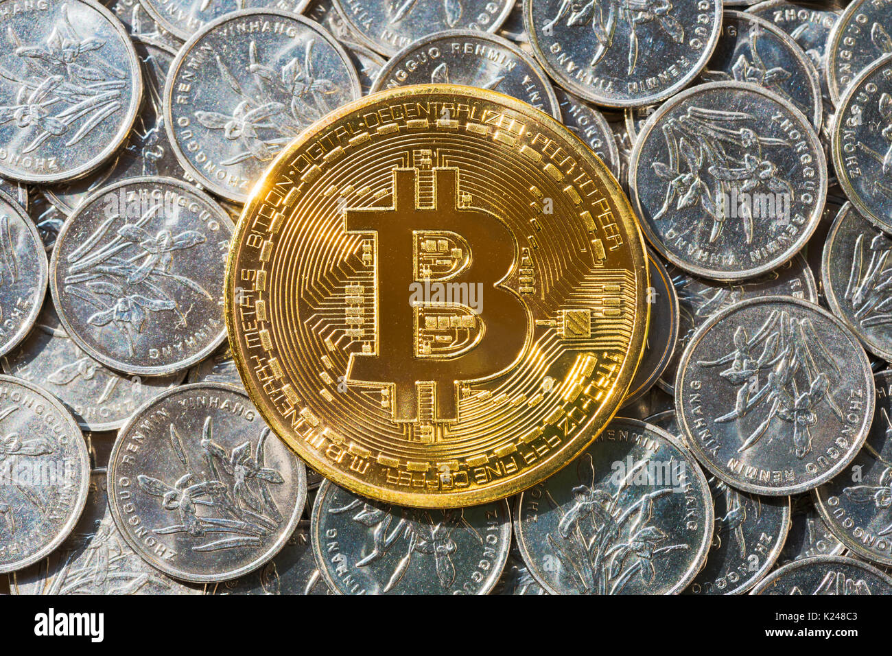 Chinese Currency Coins Stock Photos Chinese Currency Coins Stock - golden bitcoin above silver colored chinese currency coins stock image