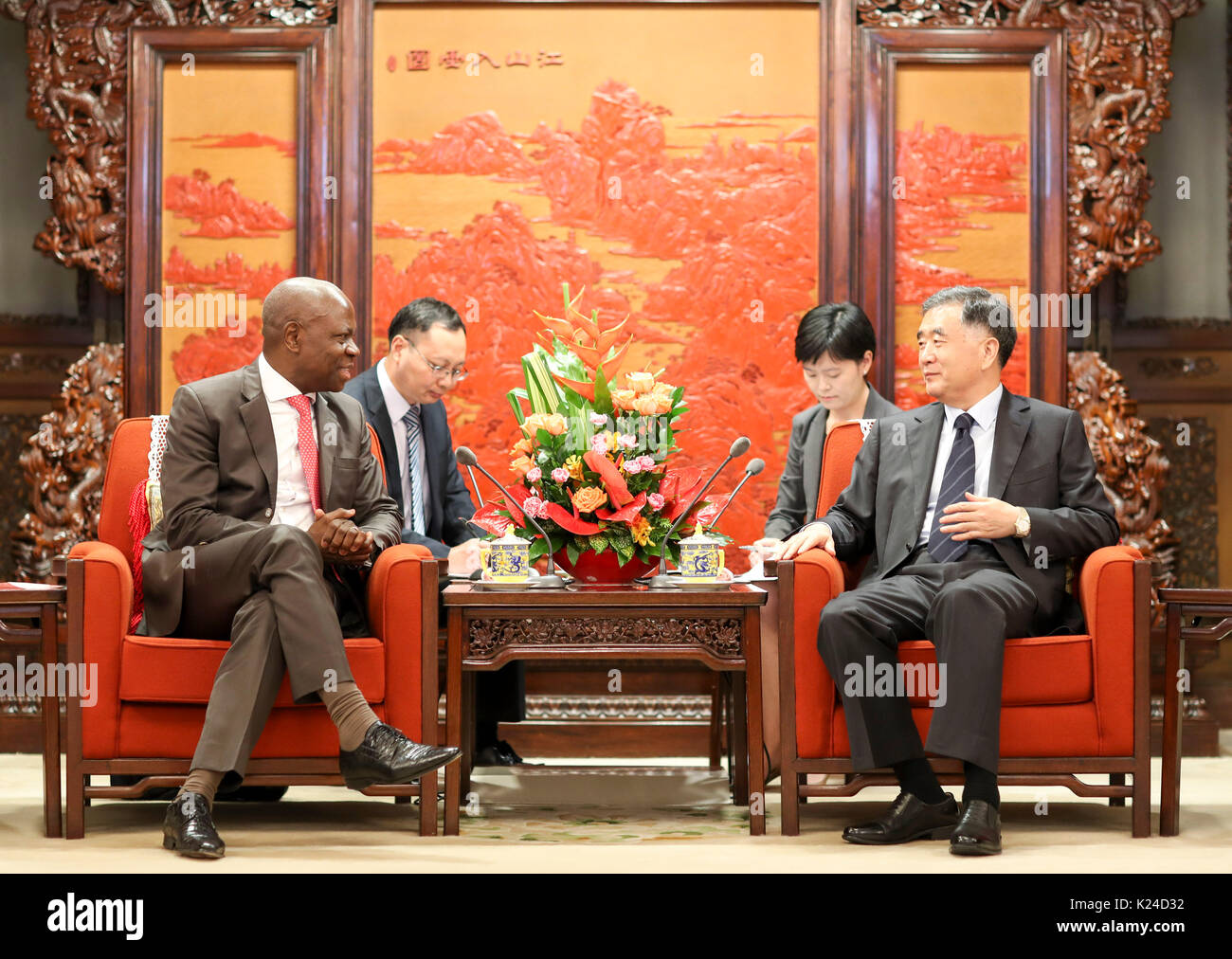 Beijing, China. 28th Aug, 2017. Chinese Vice Premier Wang Yang (R, front) meets with President of the International Fund for Agricultural Development (IFAD) Gilbert Houngbo in Beijing, capital of China, Aug. 28, 2017. Credit: Ding Lin/Xinhua/Alamy Live News Stock Photo