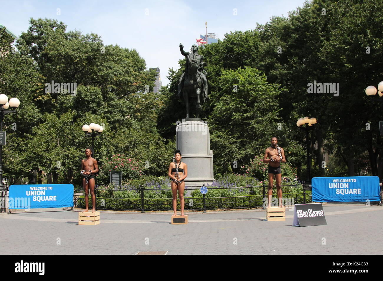 New York, NY, USA. 28th. Aug, 2017. Activists under #NeoSlaves, protesting racism among the growing movement to remove statues of slave-owning Americans in Union Square, under a statute of George Washington, the first slave-owning US President. © G. Ronald Lopez /DigiPixsAgain.us/Alamy Live News Stock Photo