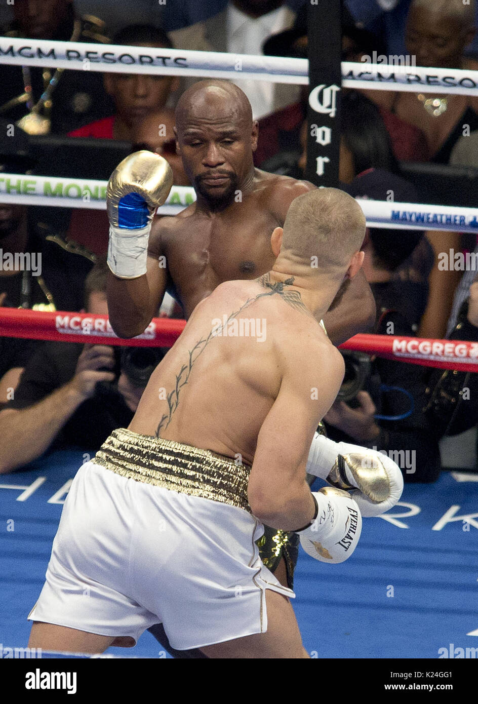 August 26, 2017 - Las Vegas, NEVADA, USA - Floyd Mayweather Jr., (Black and  Gold shorts), fights Conor McGregor (White Shorts)in a super welterweight  boxing match Saturday, Aug. 26, 2017, in Las