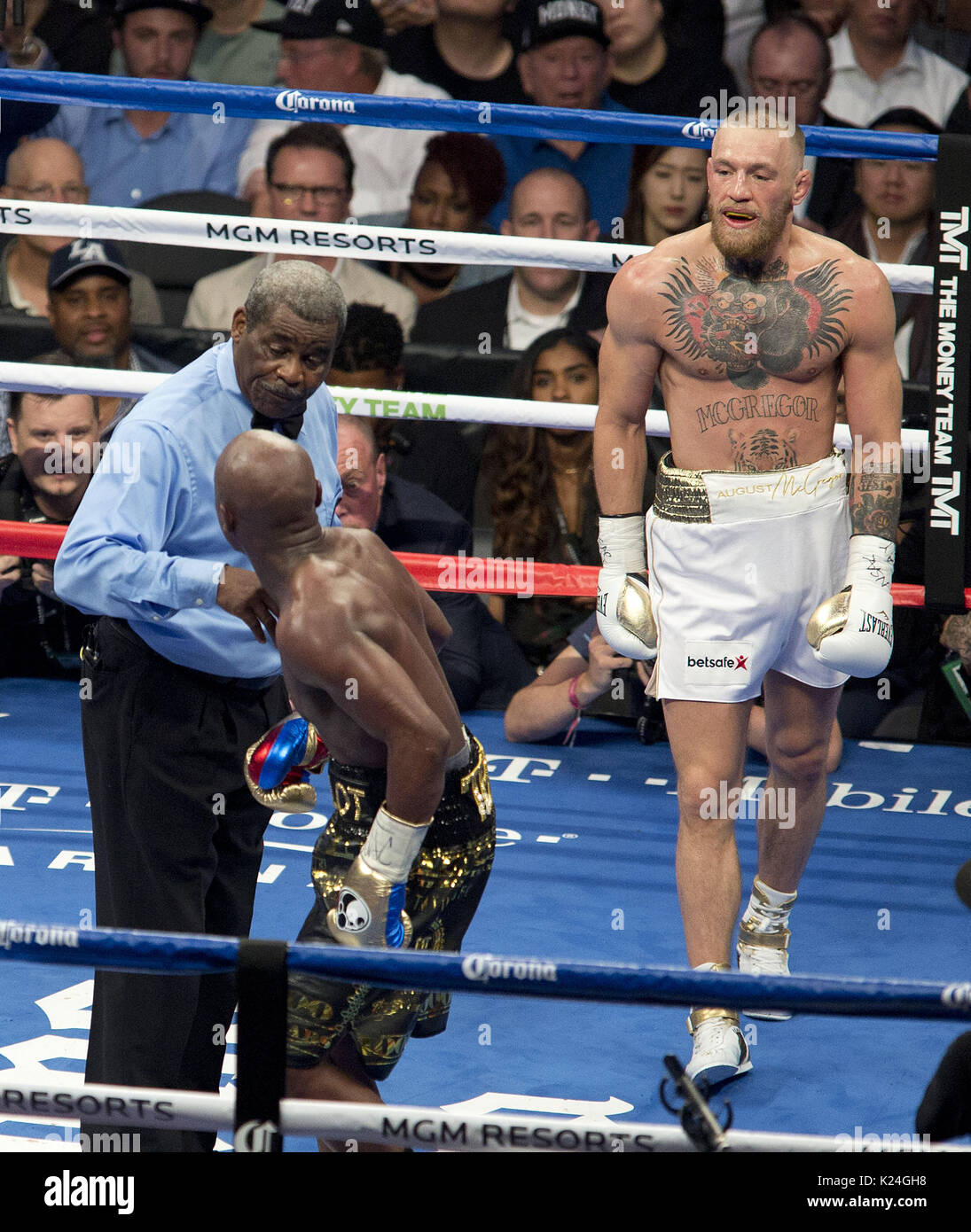 August 26, 2017 - Las Vegas, NEVADA, USA - Floyd Mayweather Jr., (Black and  Gold shorts), fights Conor McGregor (White Shorts)in a super welterweight  boxing match Saturday, Aug. 26, 2017, in Las