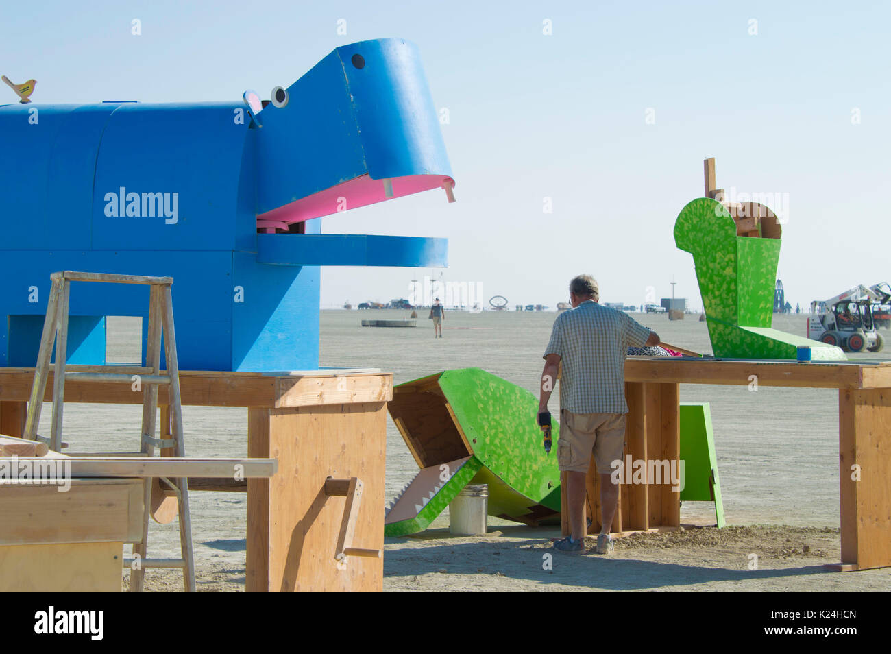 Workers put finishing touches on public art on the playa as the annual desert festival Burning Man is set to begin August 26, 2017 in Black Rock City, Nevada. The annual festival attracts 70,000 attendees in one of the most remote and inhospitable deserts in America. Stock Photo