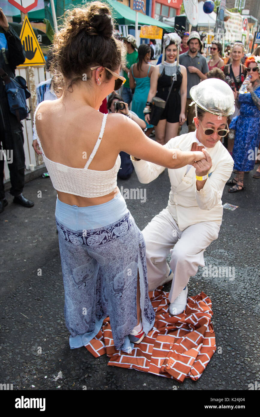 London, UK. 28th August, 2017. A reveller dances with singer Natty Bo at the Gaz's Rockin' Blues sound system. Hundreds of thousands of people took part in the Notting Hill Carnival in West London. The event took on added significance this year because of its proximity to the Grenfell Tower and a minute's silence was observed at 3pm. Credit: Mark Kerrison/Alamy Live News Stock Photo