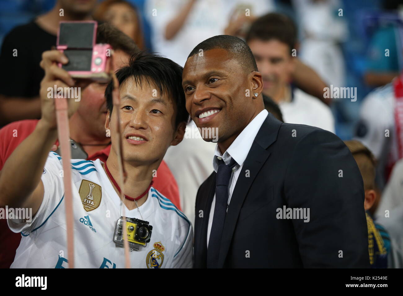 Former Real Madrid player Julio Baptista with a fan. Real Madrid defeated Barcelona 2-0 in the second leg of the Spanish Supercup football match at th Stock Photo