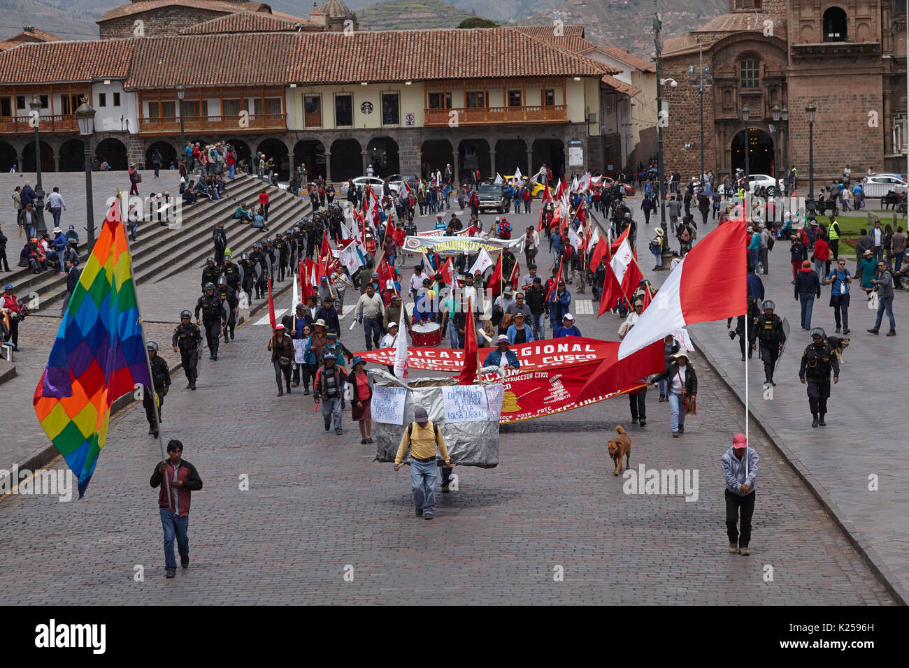Protesters and Inca Wiphala Flag and Peruvian Flag, Plaza de Armas, Cusco, Peru, South America Stock Photo