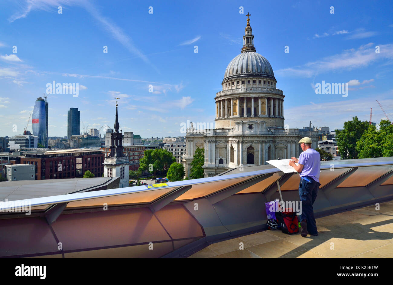 London, England, UK. St Paul's Cathedral seen from the public rooftop terrace of One New Change - artist drawing the cathedral Stock Photo