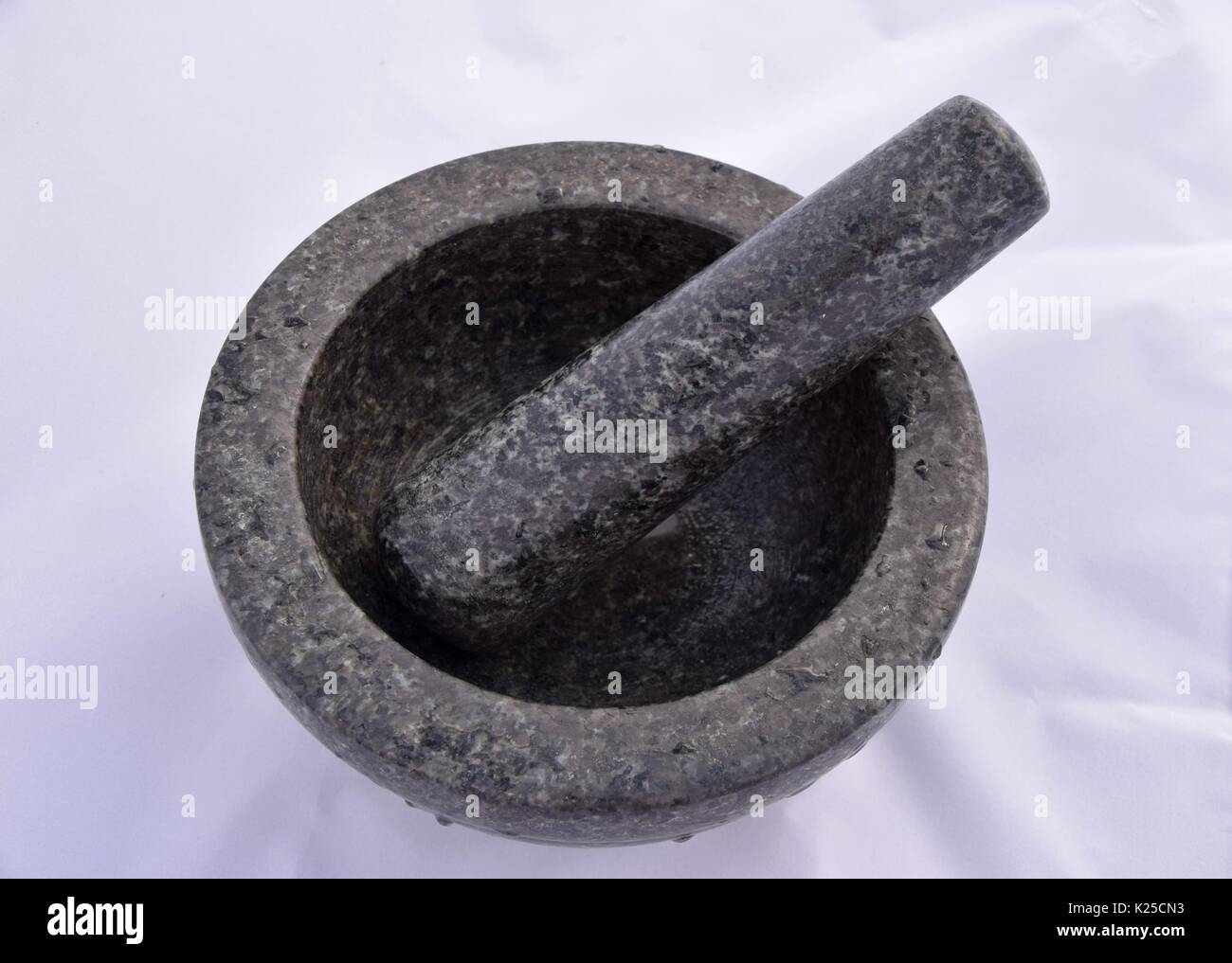 Mortar and pestle made of black marble or granite, grind the spices ...