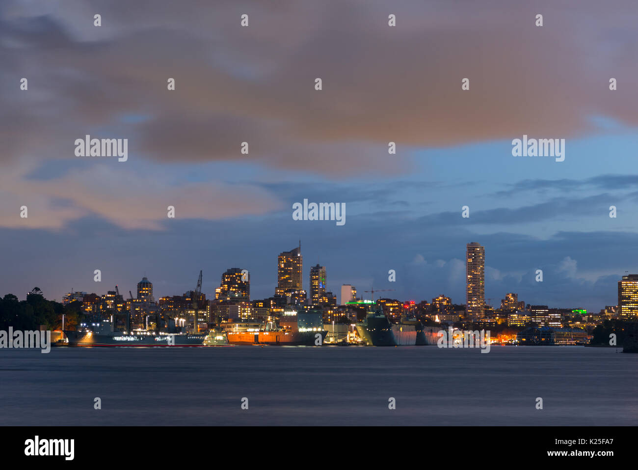Garden Island Naval base and Potts Point skyline at dusk, seen from Cremorne point. Sydney Harbour, New South Wales, Australia. Stock Photo