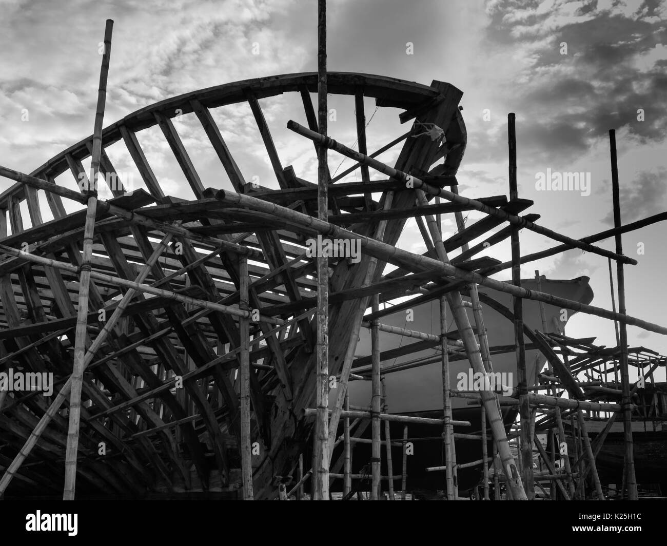 Wooden made fishing boat being manufactured or repaired in Manta - Murciélago Beach - Ecuador Stock Photo