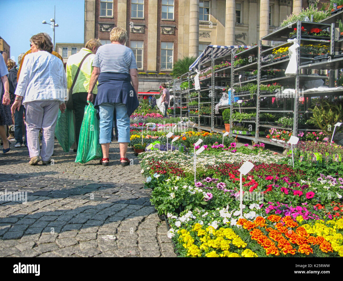 People looking at flowers on the yearly flowermarket on Good Friday in