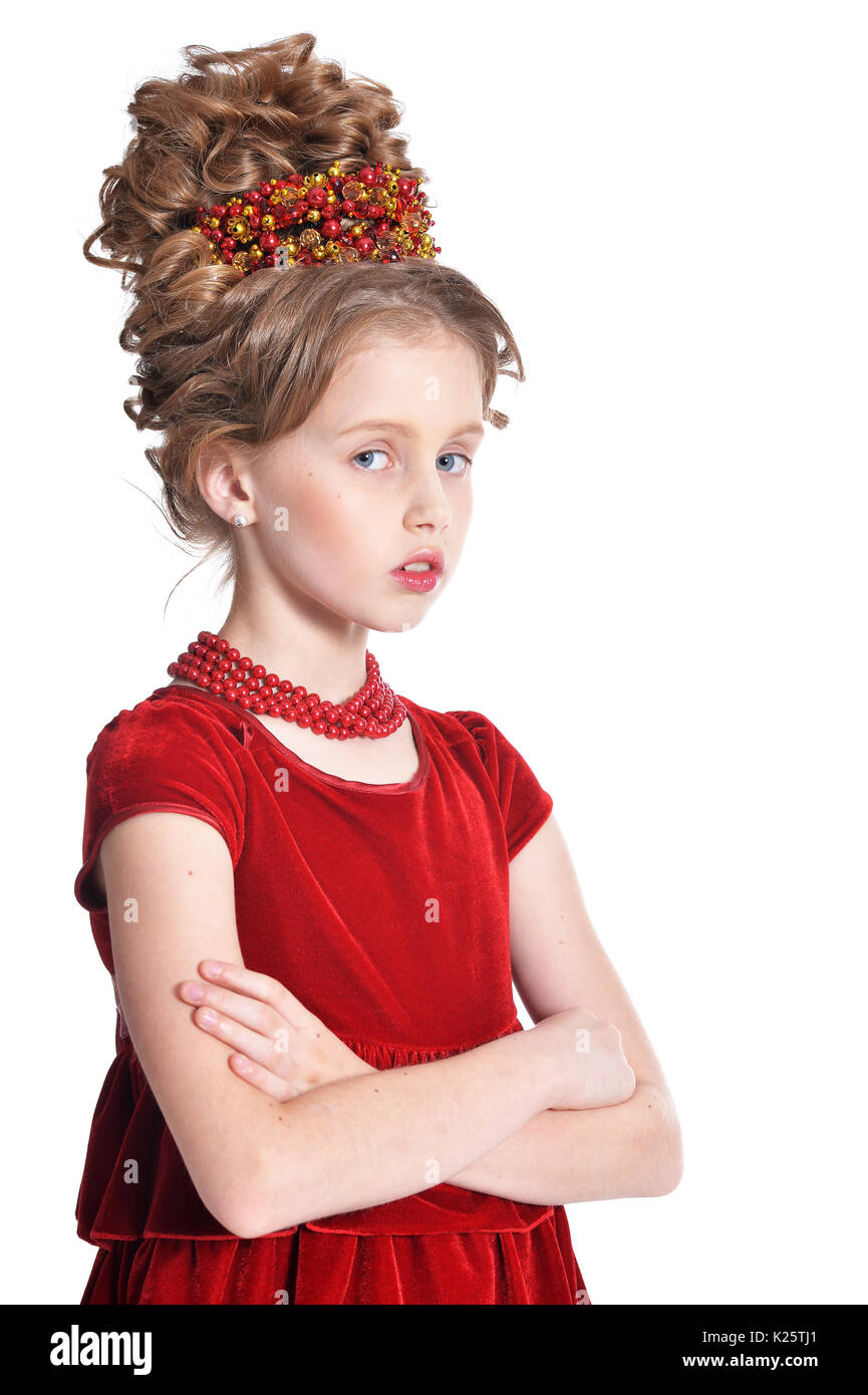 Cute little girl in red velvet dress with retro hairstyle isolated on