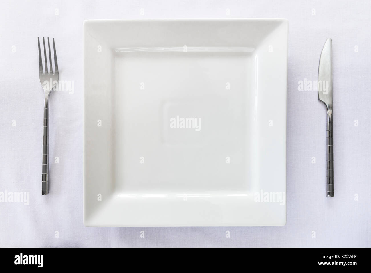 Single place table setting, knife fork plate Stock Photo Alamy