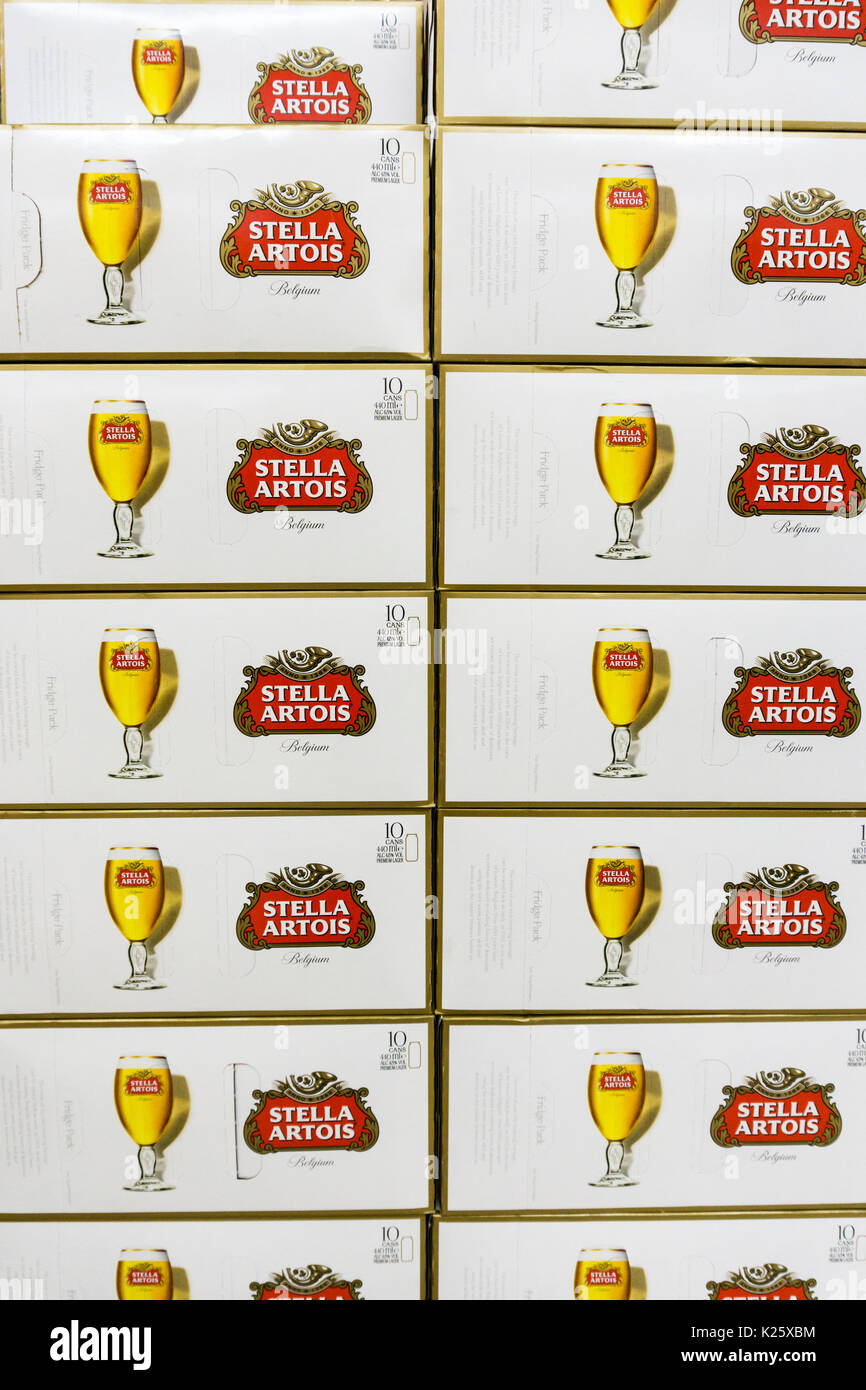 Boxes of Stella Artois lager cans on a British supermarket shelf Stock Photo