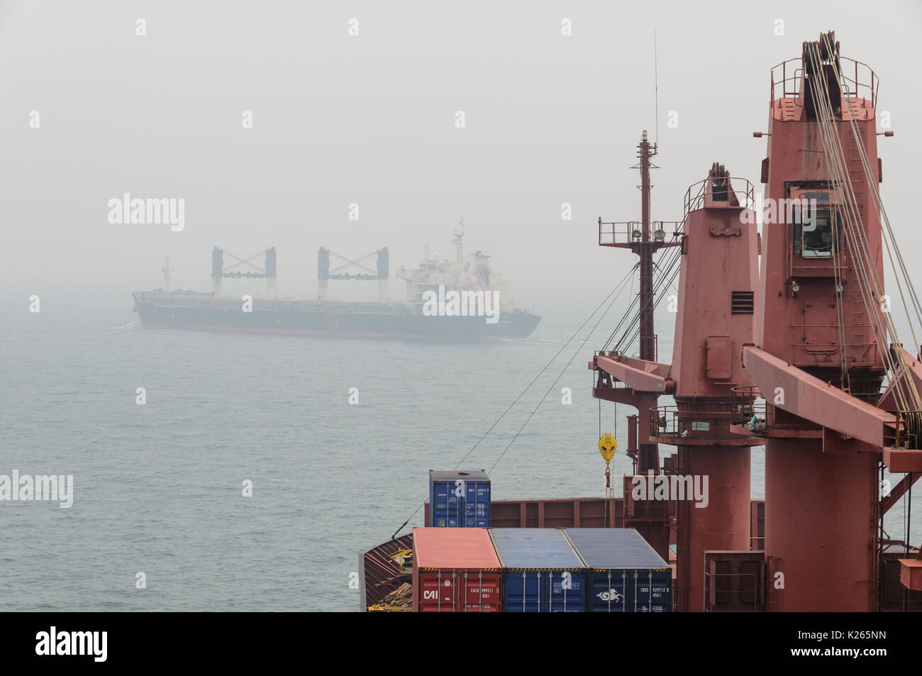 Ship Conducting Anti Collision Manoeuvre in Singapore Strait Stock Photo