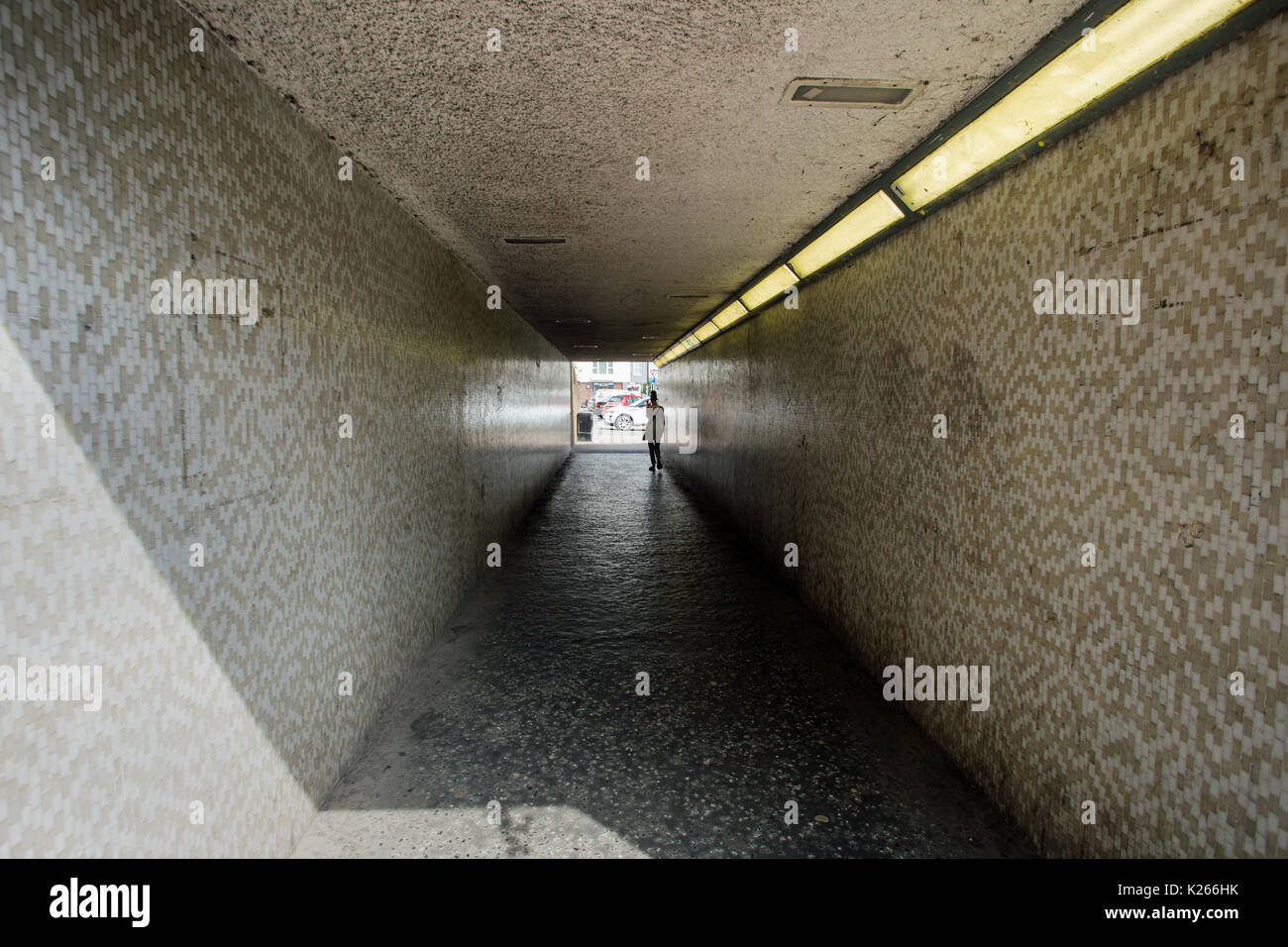 August 2017, Wickford, Essex, England, A modern underpass with a person ...