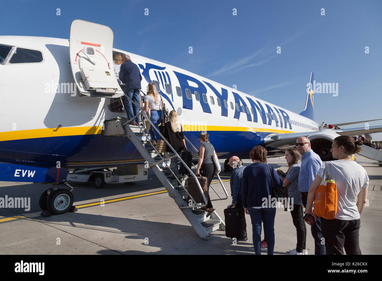 Boarding Ryanair plane - passengers boarding a Ryanair plane at Stansted airport UK Stock Photo