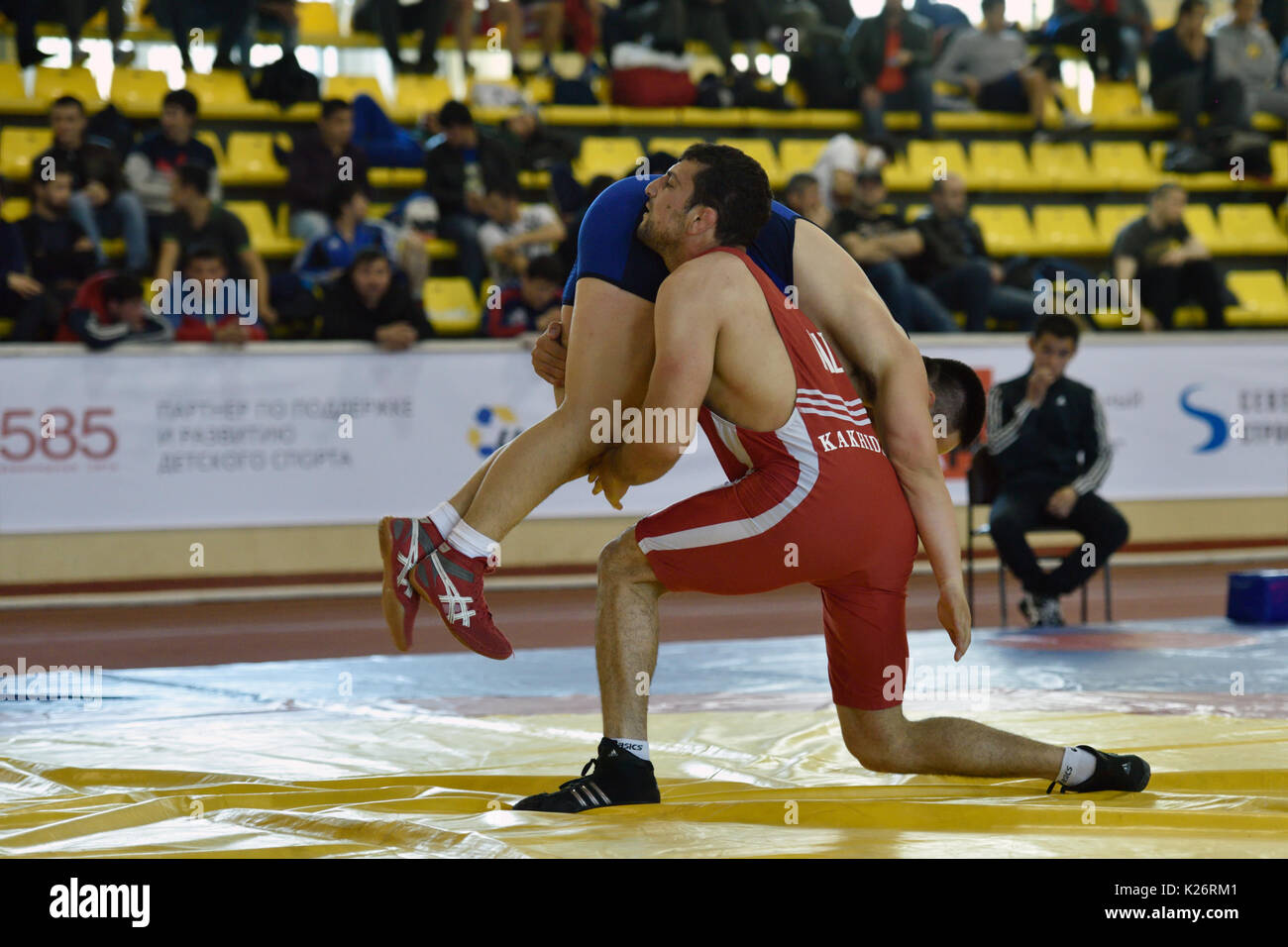 St. Petersburg, Russia - May 6, 2015: Aslan Kakhidze of Kazakhstan against unidentified athlete during International freestyle wrestling tournament Vi Stock Photo