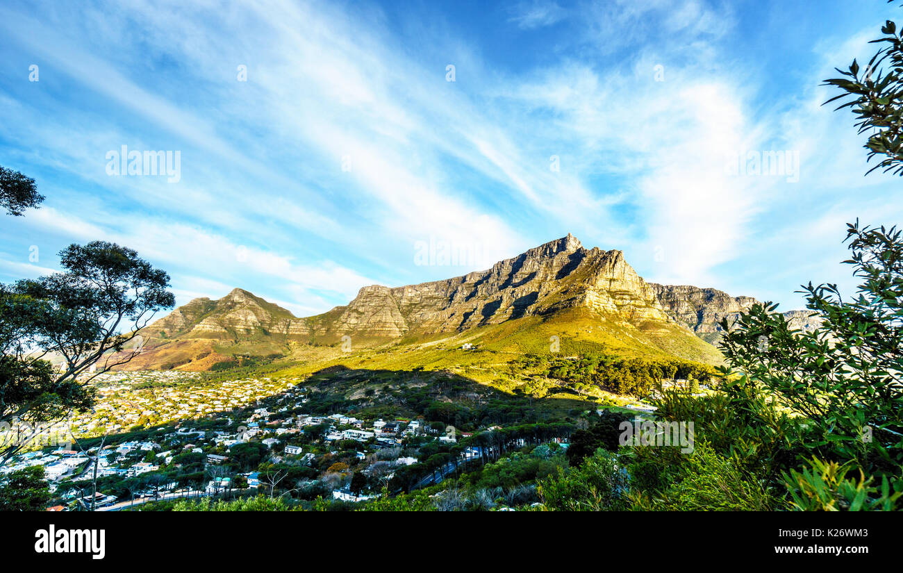 Sun setting over Cape Town, Table Mountain, Devils Peak, Lions Head and the Twelve Apostles. Viewed from Signal Hill at Cape Town, South Africa Stock Photo