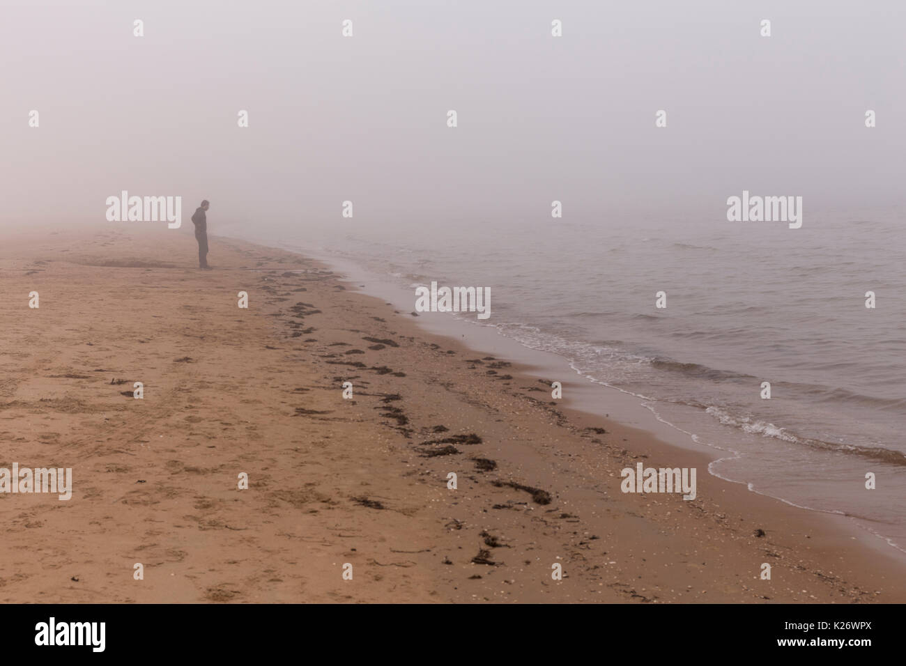 Lonely man on the beach at Mellbystrand, Halland, Sweden Stock Photo