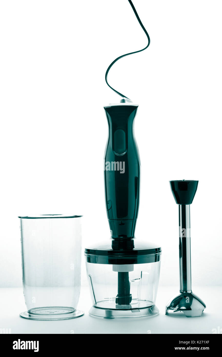 closeup of a black hand blender and some accessories on a white background Stock Photo