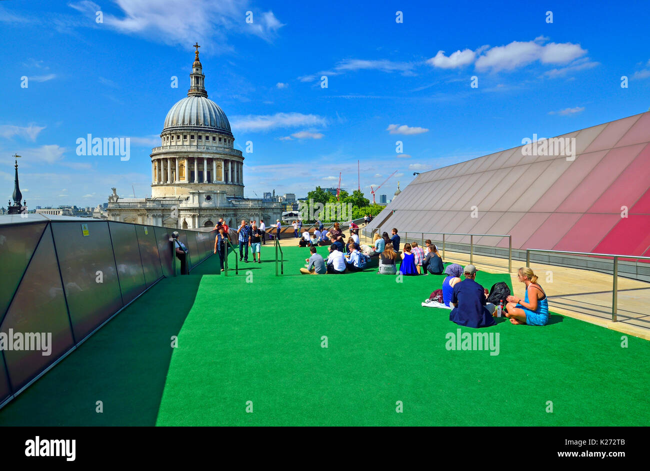London, England, UK. St Paul's Cathedral seen from the public rooftop terrace of One New Change - people having lunch on a sunny day in August Stock Photo