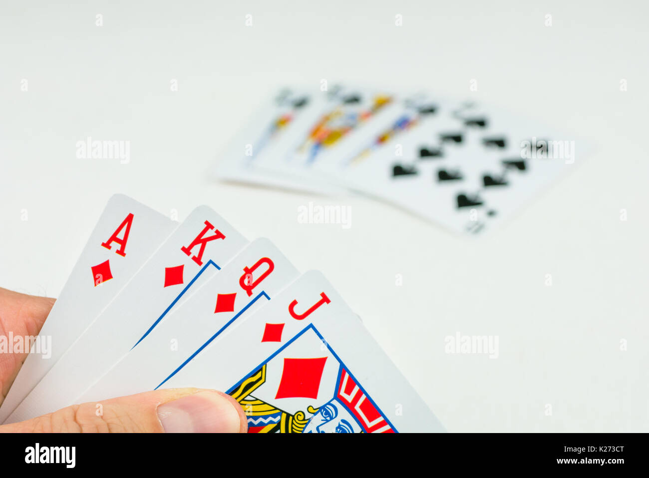 Playing cards in poker. One card more - will be an Royal Flush. Stock Photo